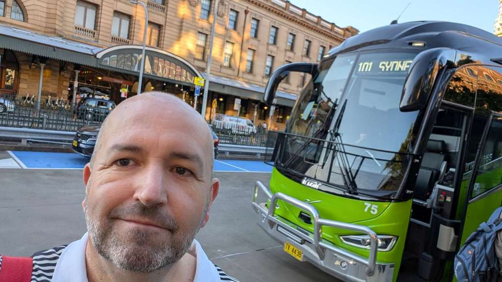 Angus Kidman ready to board the bus